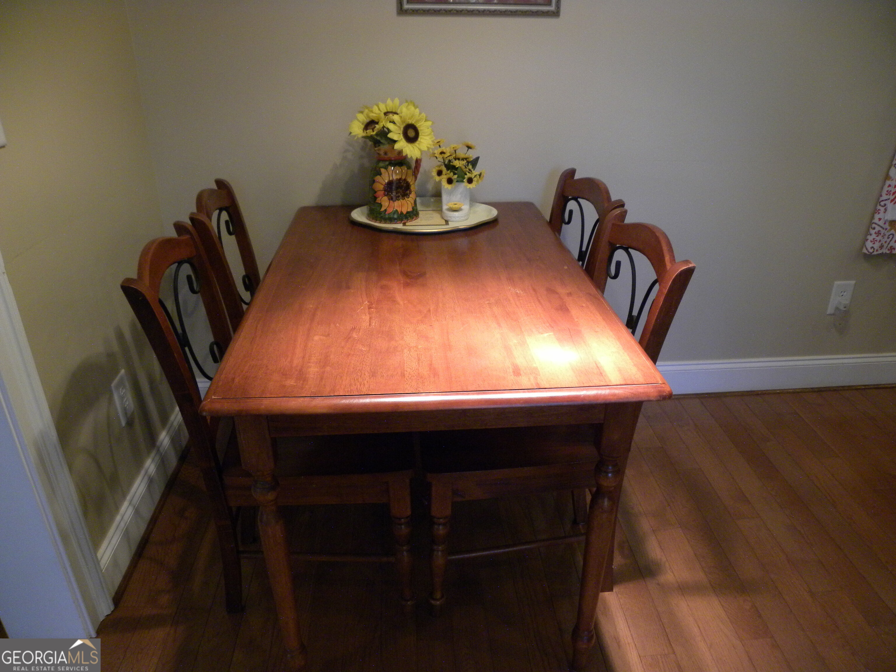 2484 Apple Pie Ridge Road, Unit 11 Alto, GA 30510 - Photo 35 of 95 a room with a table chairs and a wooden floor