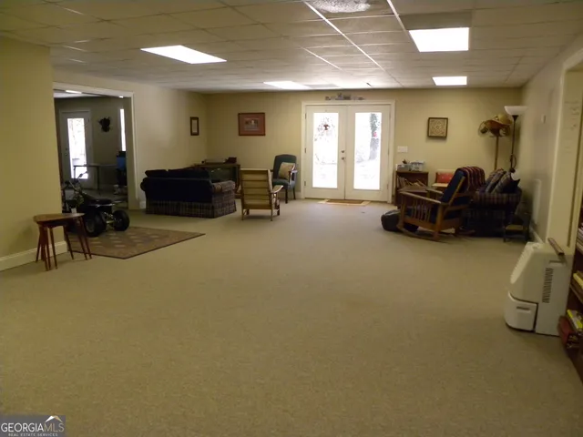 a view of a house with snow on the side of the road