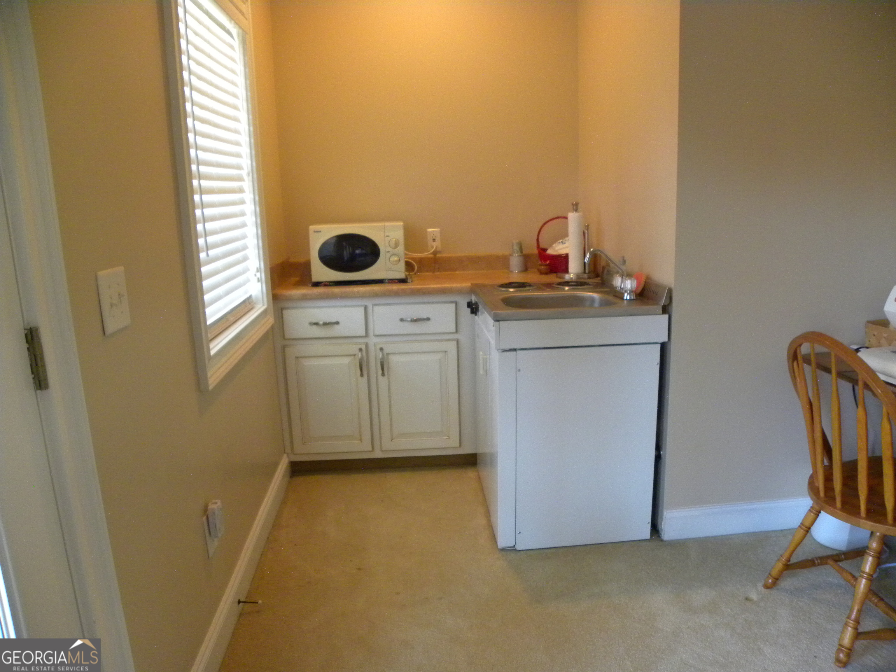 2484 Apple Pie Ridge Road, Unit 11 Alto, GA 30510 - Photo 69 of 95 a bathroom with a granite countertop sink a mirror and a toilet