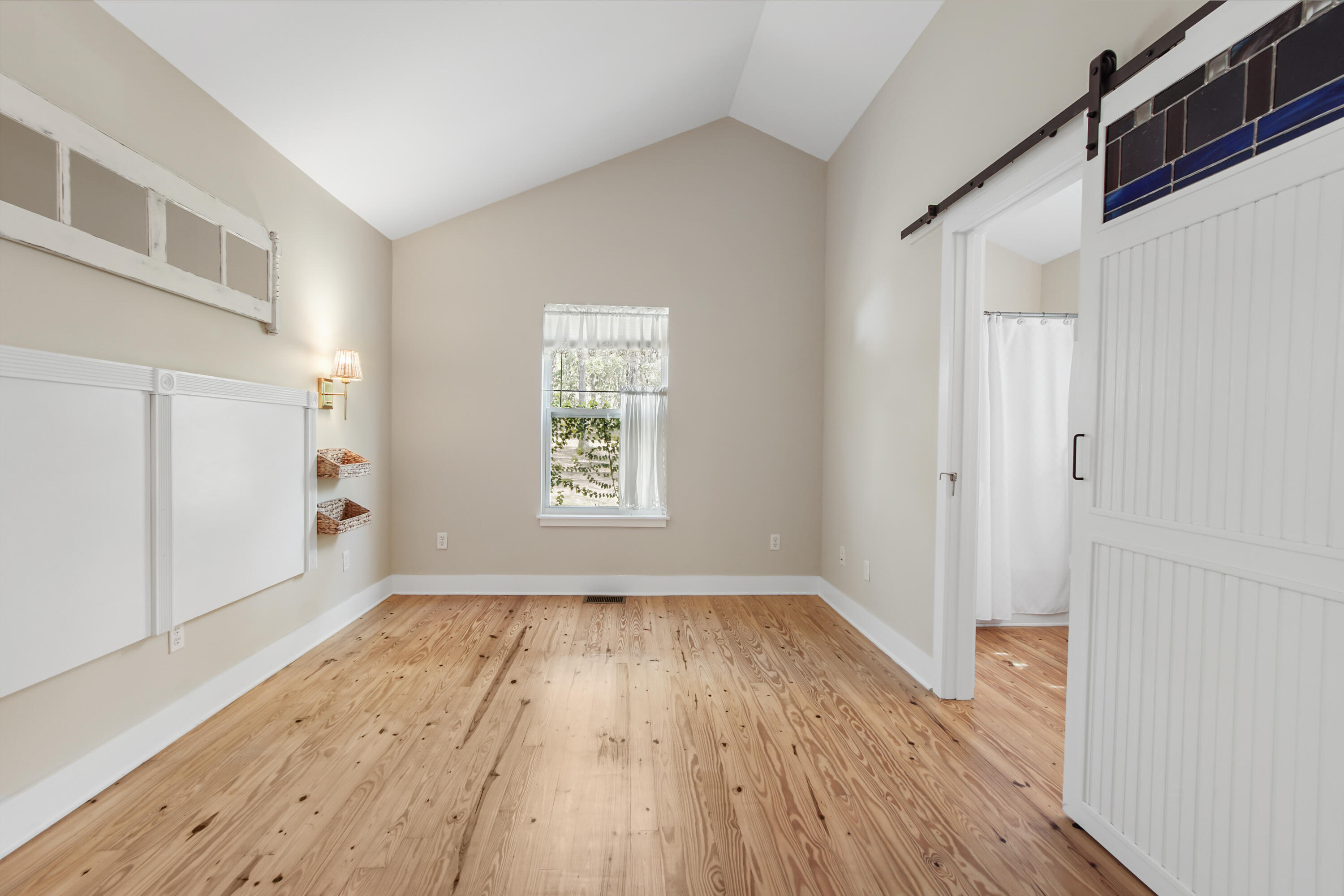 211 Lester Price Road Ponce de Leon, FL 32455 - Photo 14 of 63 a view of empty room with wooden floor and fan