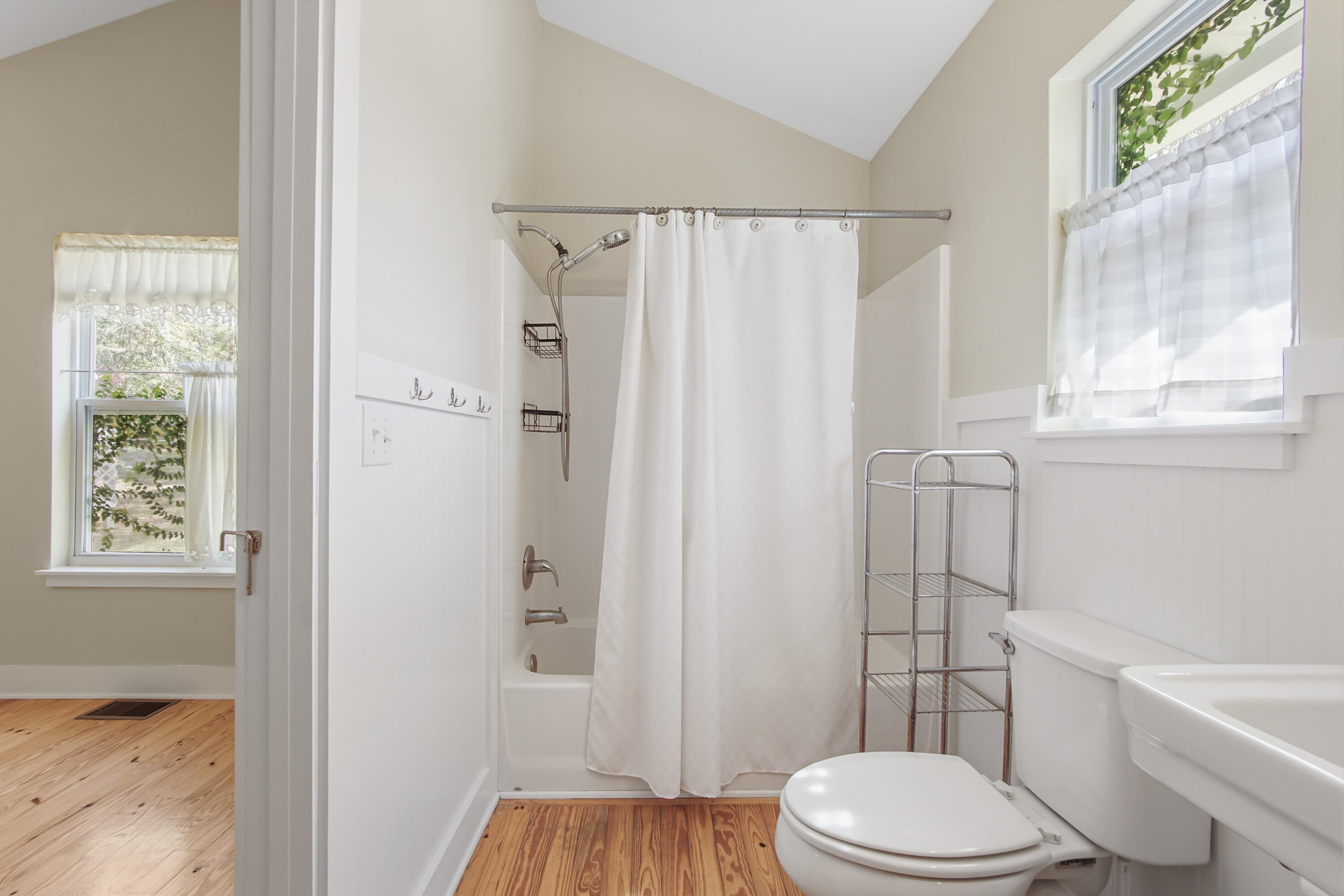 211 Lester Price Road Ponce de Leon, FL 32455 - Photo 18 of 63 a white toilet sitting next to a bathroom sink and tub
