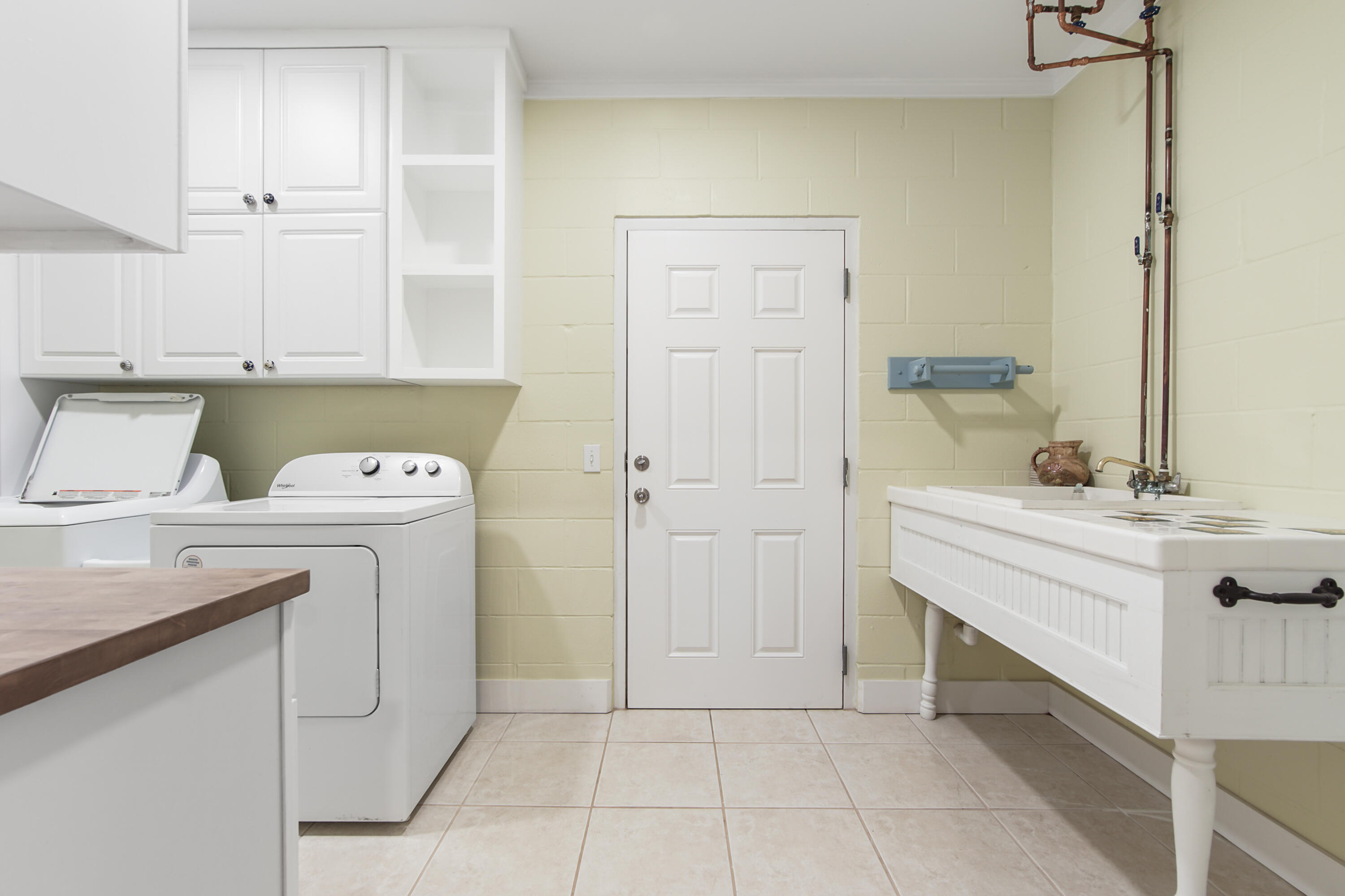211 Lester Price Road Ponce de Leon, FL 32455 - Photo 24 of 63 a view of a storage and utility room with closet dryer and washer