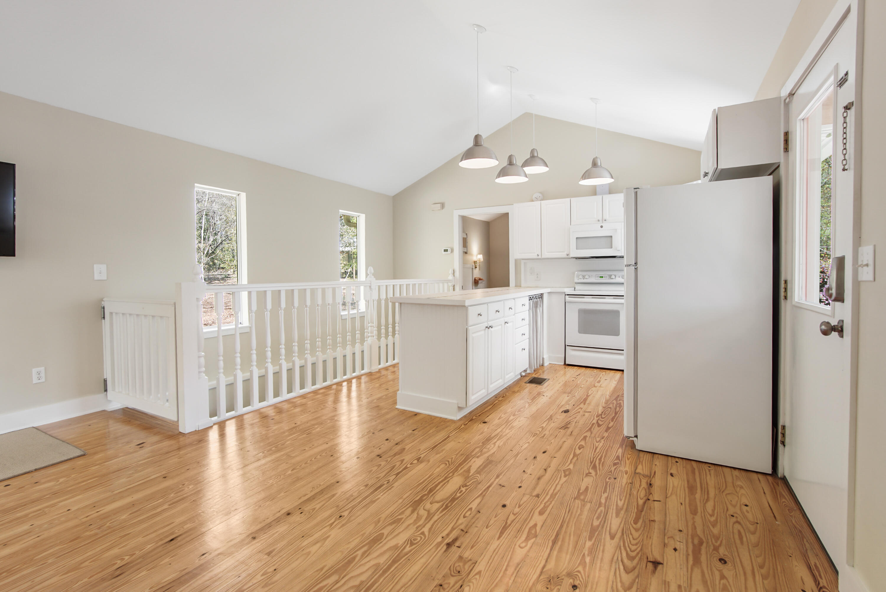211 Lester Price Road Ponce de Leon, FL 32455 - Photo 3 of 63 a kitchen with stainless steel appliances a refrigerator and wooden floor