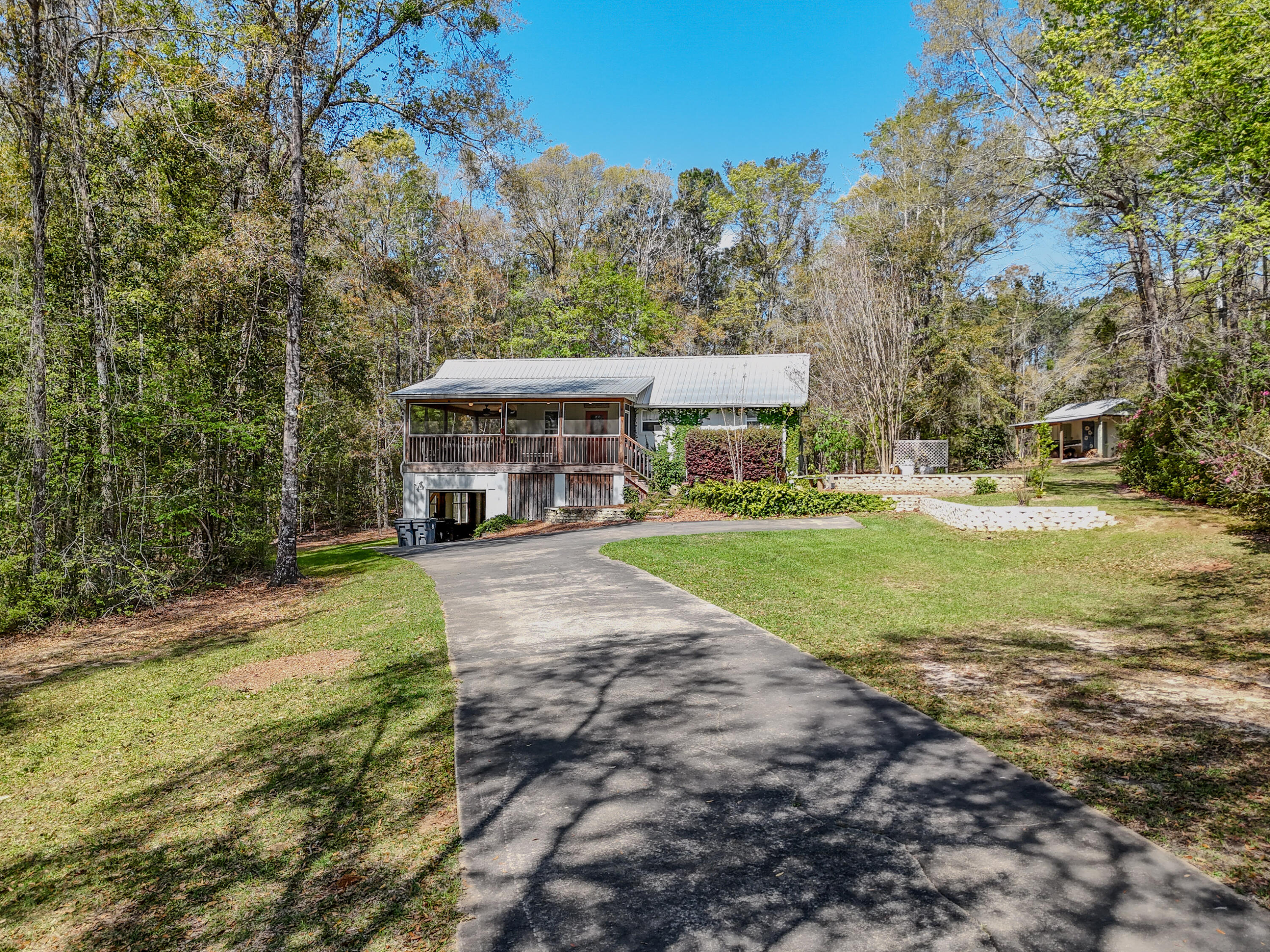 211 Lester Price Road Ponce de Leon, FL 32455 - Photo 40 of 63 a view of a house with yard and basketball ground