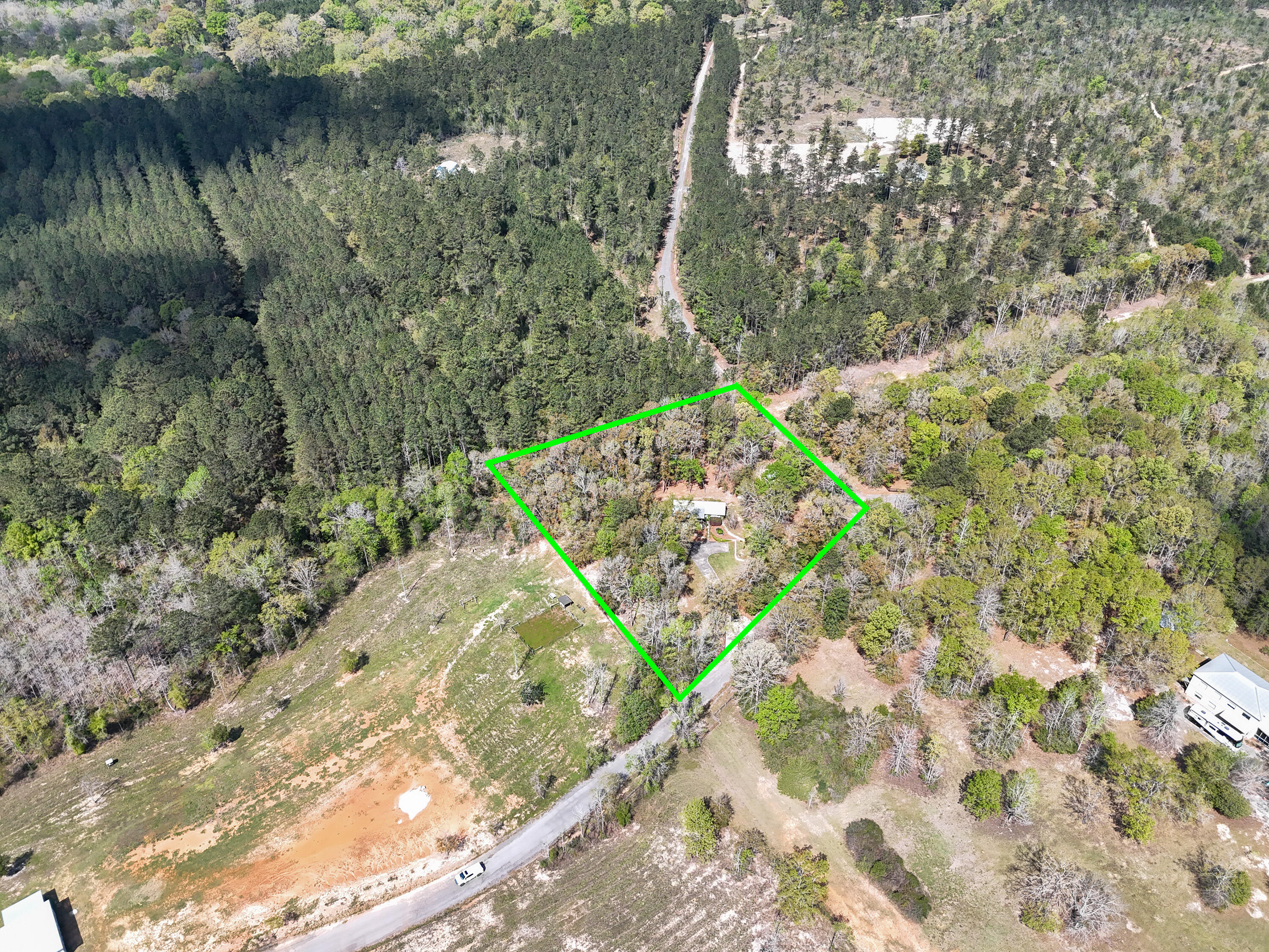 211 Lester Price Road Ponce de Leon, FL 32455 - Photo 45 of 63 a view of a lake with a yard