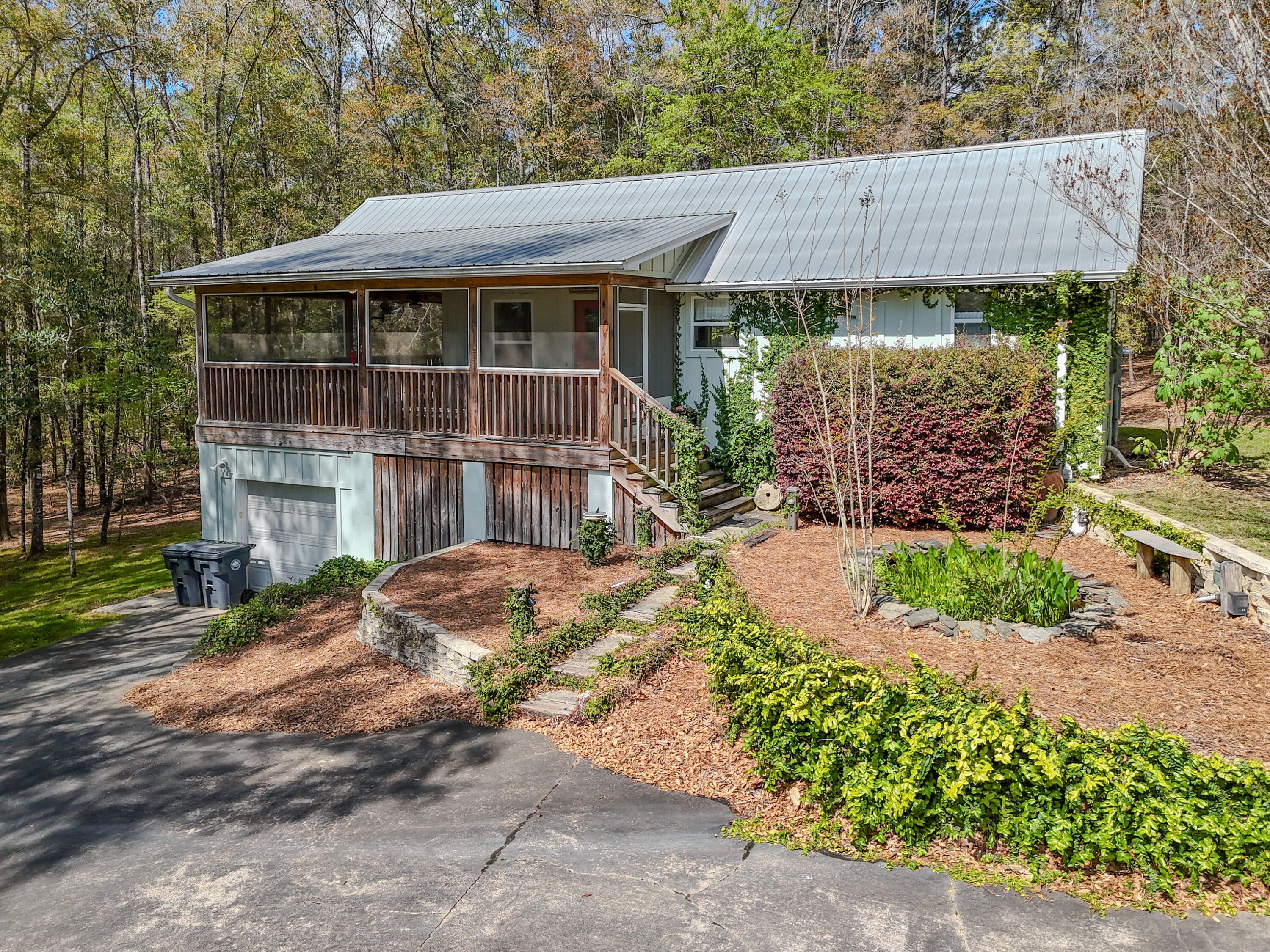 211 Lester Price Road Ponce de Leon, FL 32455 - Photo 58 of 63 a front view of a house with garden