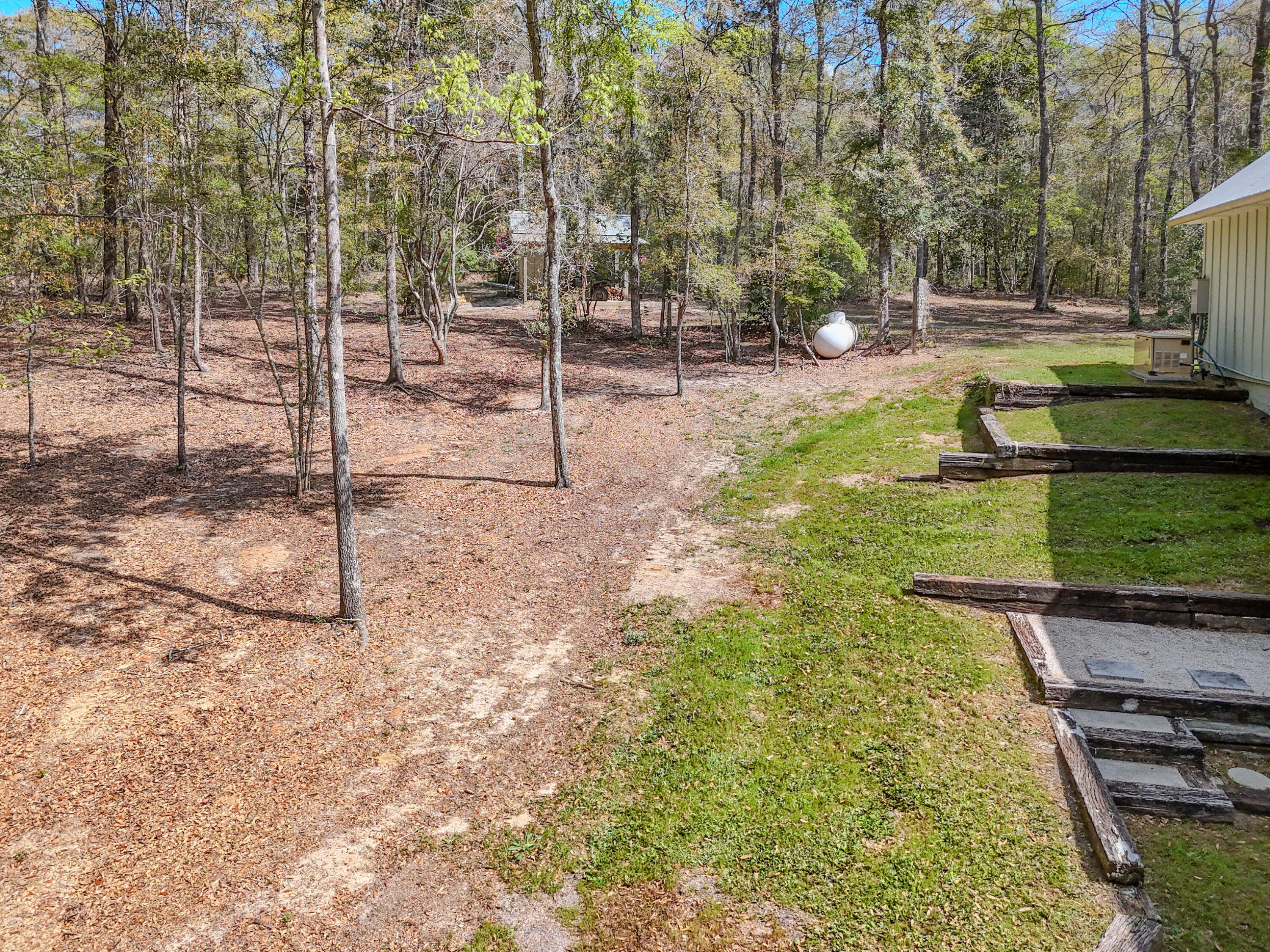 211 Lester Price Road Ponce de Leon, FL 32455 - Photo 59 of 63 a backyard of a house with lots of green space