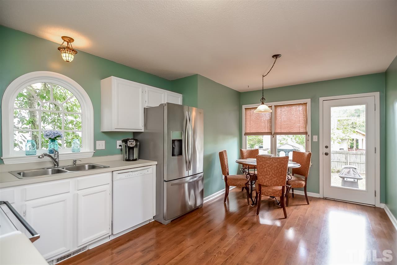 4016 Iron Horse Road Raleigh, NC 27616 - Photo 8 of 24 Open and bright with arched window and Tiffany light fixture at the sink.