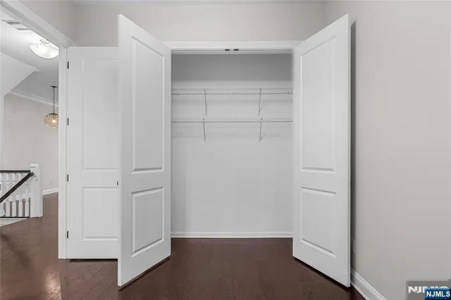 a bathroom with a sink toilet vanity and shower