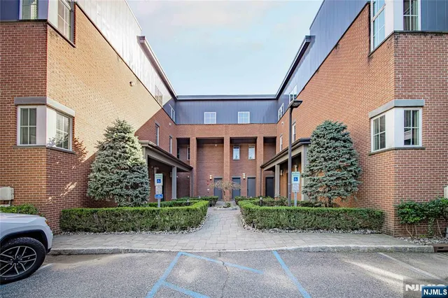a view of kitchen with sink and wooden floor