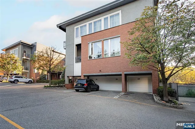 a backyard of a house with a yard and outdoor seating