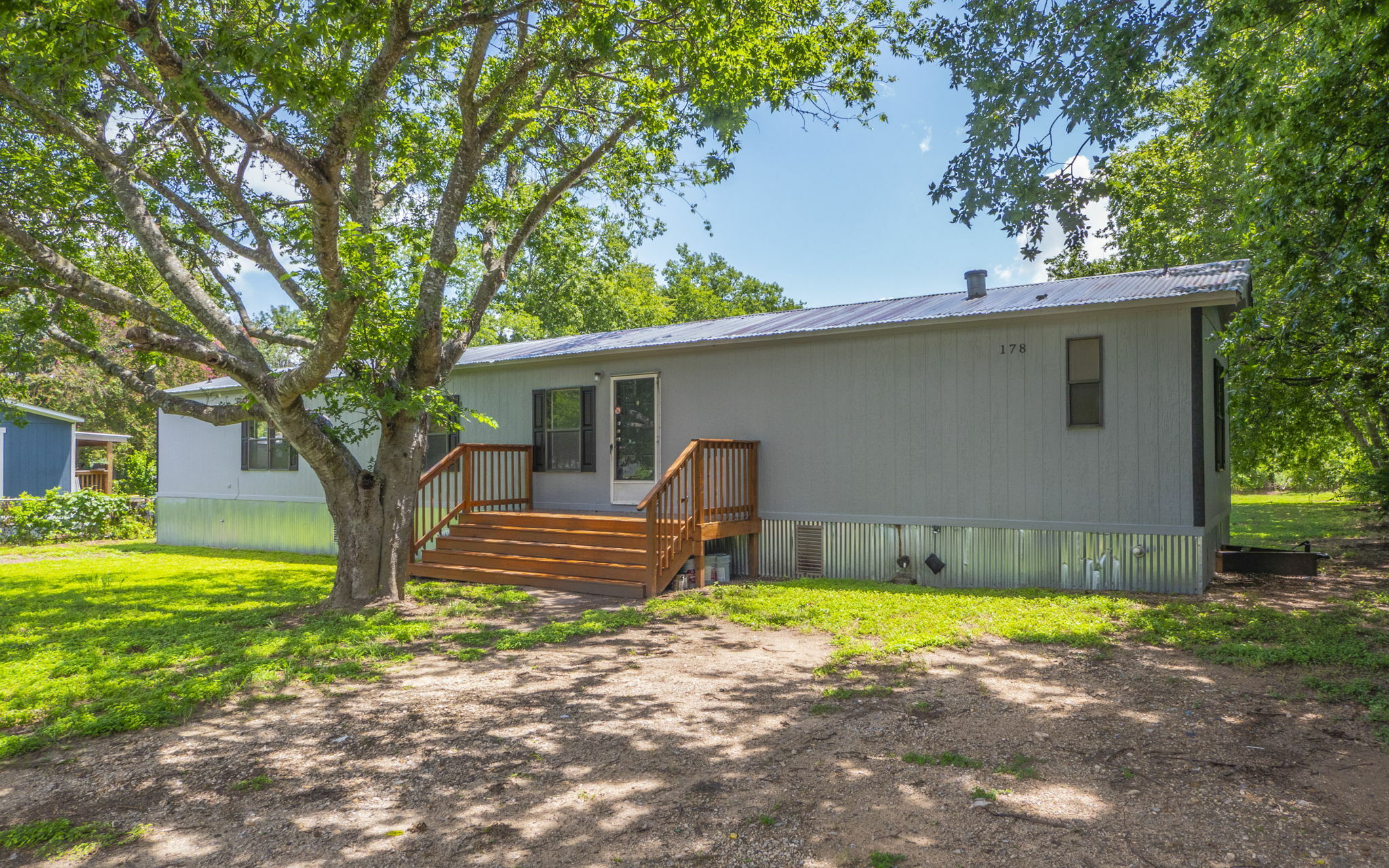 a view of a house with swimming pool and yard