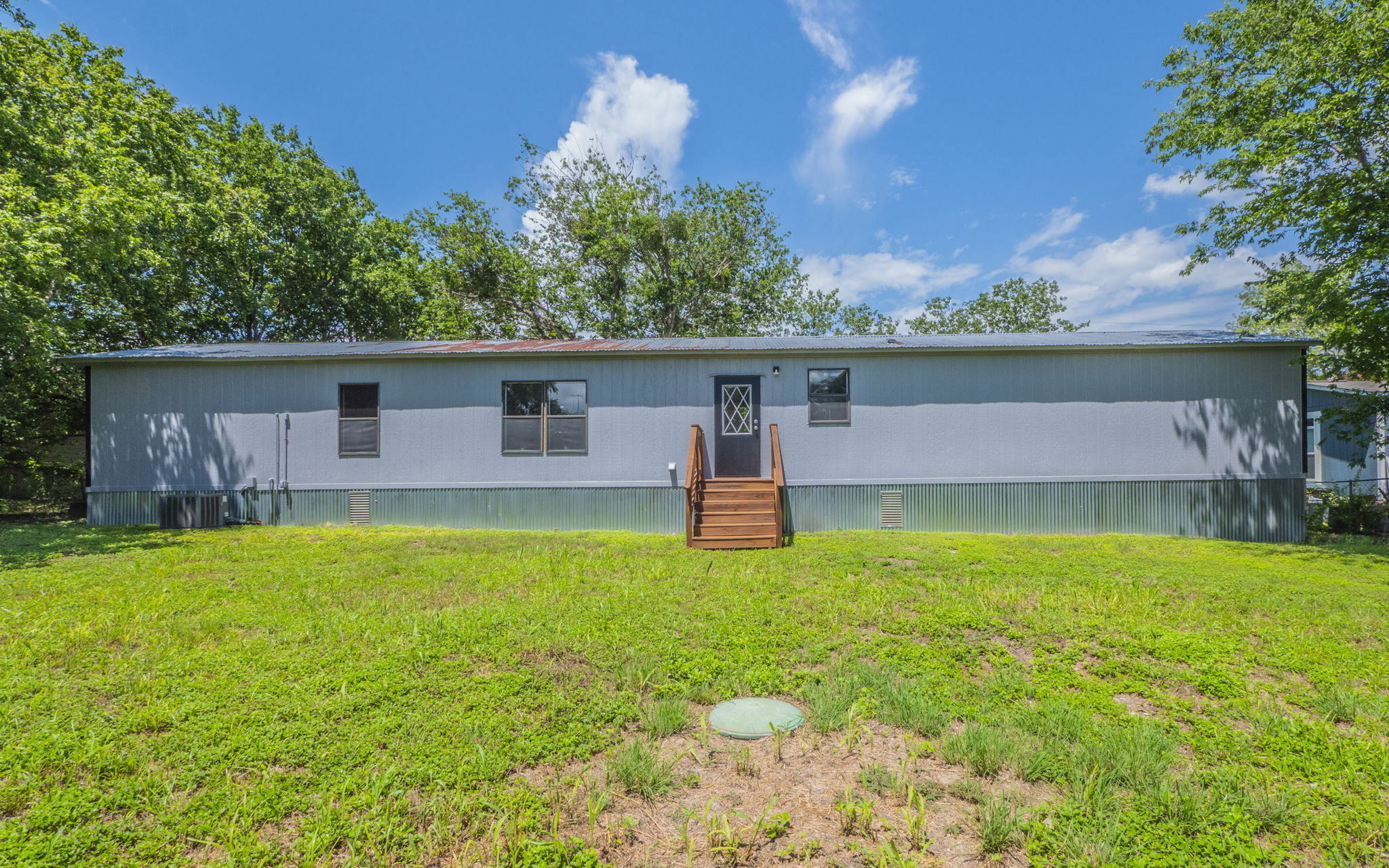 178 Quail Ridge Drive Kyle, TX 78640 - Photo 15 of 18 a front view of house with yard and outdoor seating