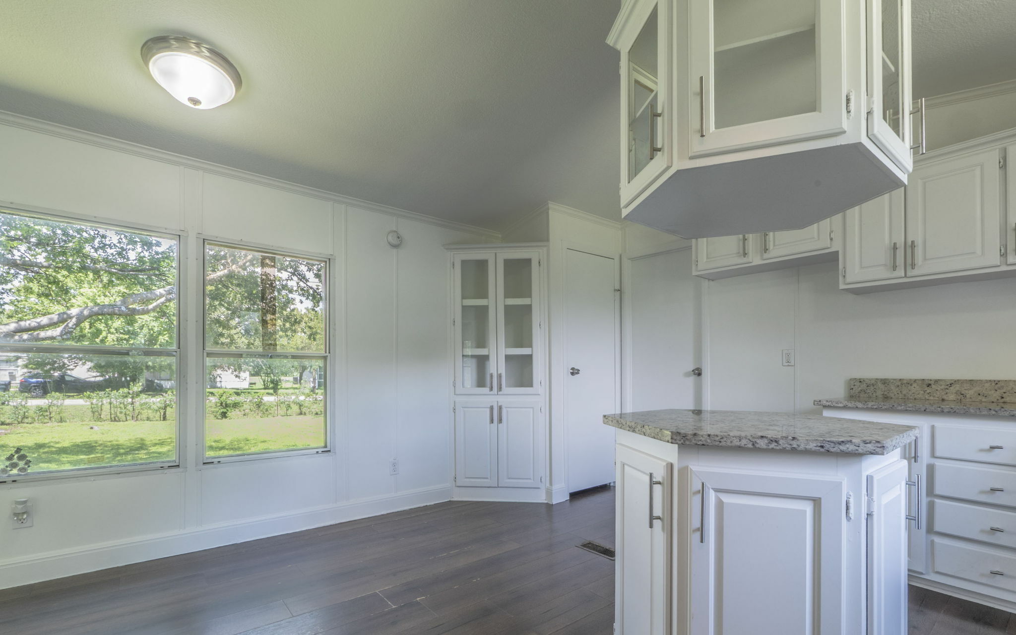 178 Quail Ridge Drive Kyle, TX 78640 - Photo 4 of 18 wooden floor in an empty room with a window