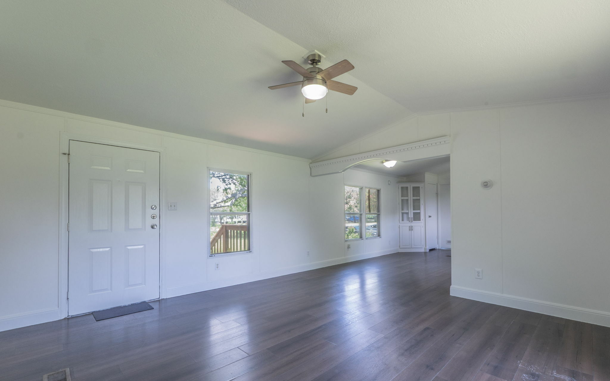 178 Quail Ridge Drive Kyle, TX 78640 - Photo 5 of 18 wooden floor in an empty room with a window