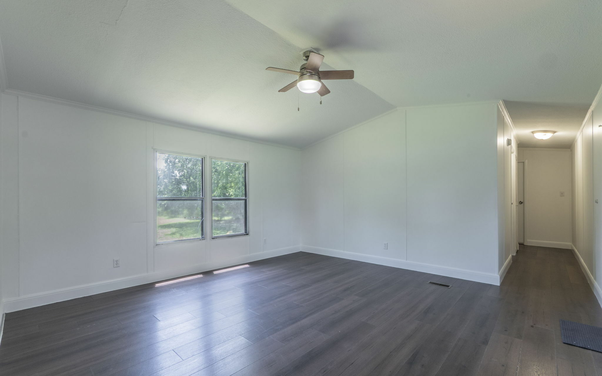 178 Quail Ridge Drive Kyle, TX 78640 - Photo 6 of 18 wooden floor in an empty room with a window