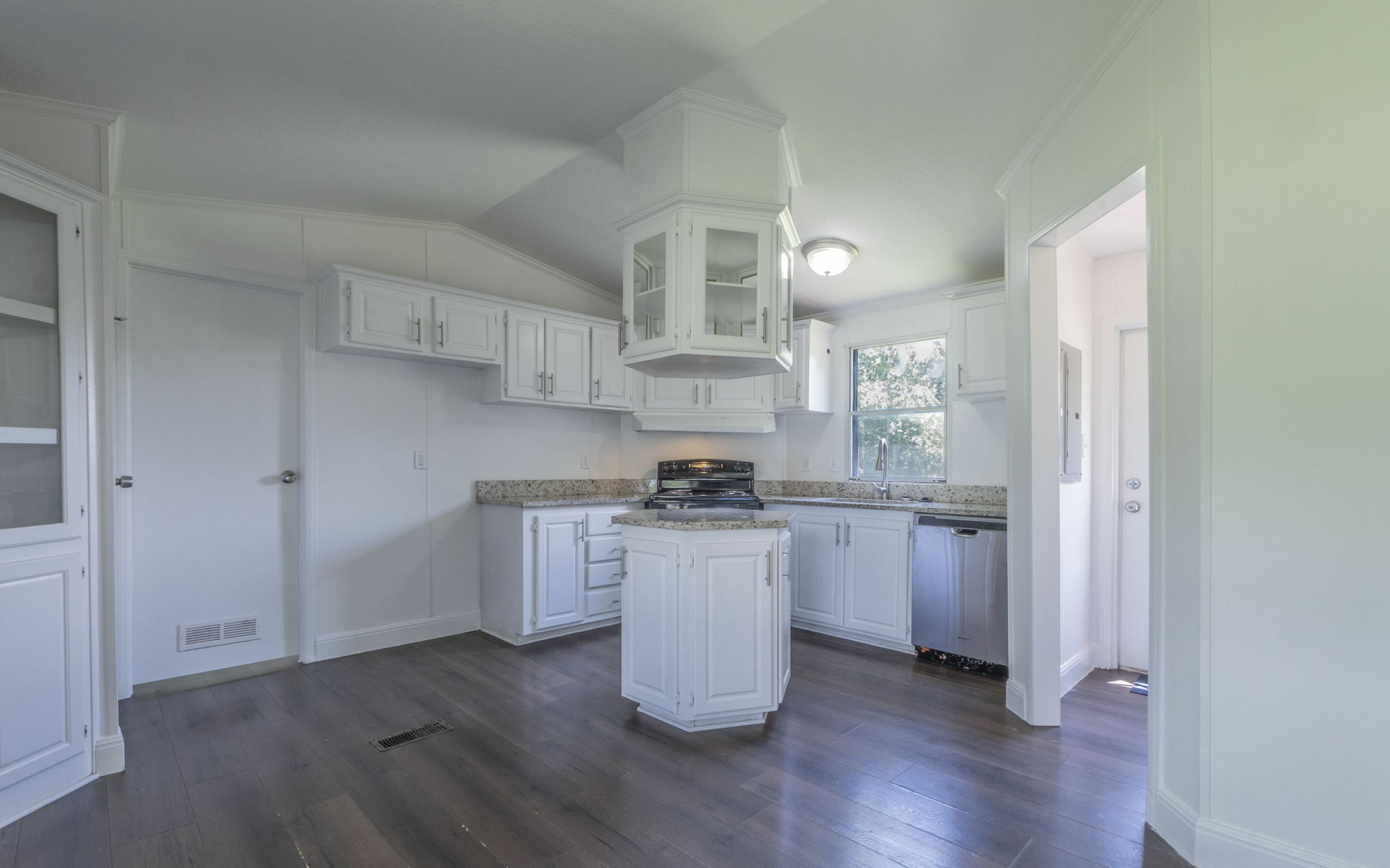 178 Quail Ridge Drive Kyle, TX 78640 - Photo 7 of 18 a kitchen with a stove a sink and a refrigerator