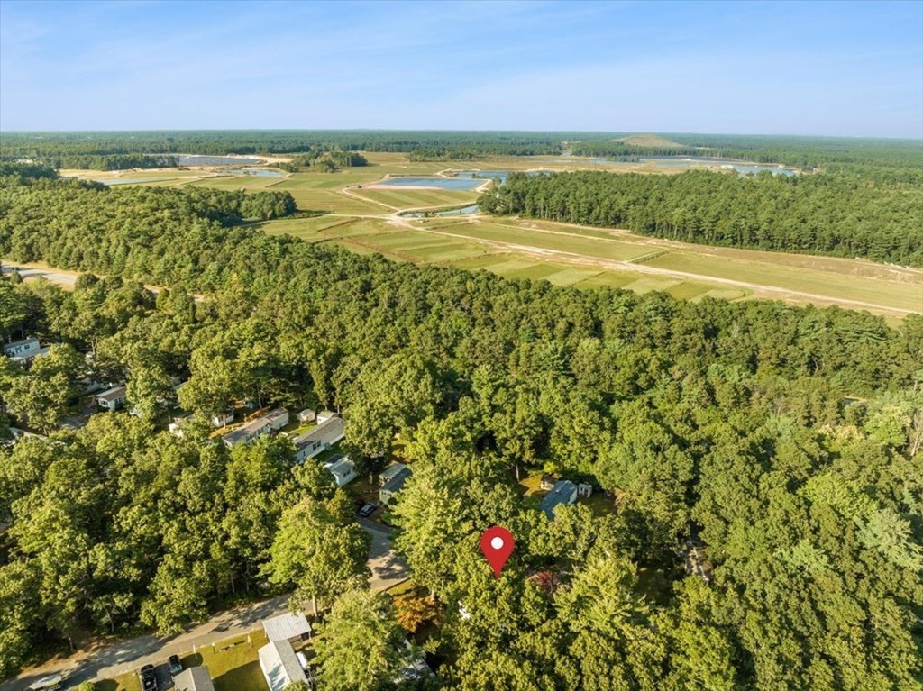 209 Windswept Road Wareham, MA 02571 - Photo 14 of 17 a view of an ocean and a yard