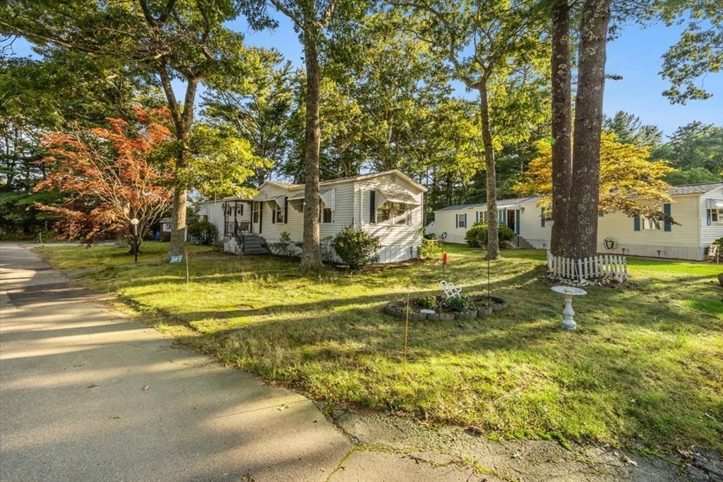 209 Windswept Road Wareham, MA 02571 - Photo 3 of 17 a view of a swimming pool with an outdoor space