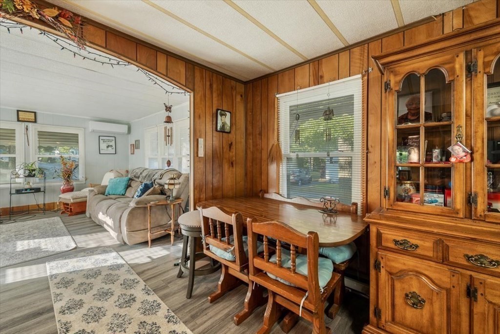 209 Windswept Road Wareham, MA 02571 - Photo 9 of 17 a dining room with furniture a rug and a large window