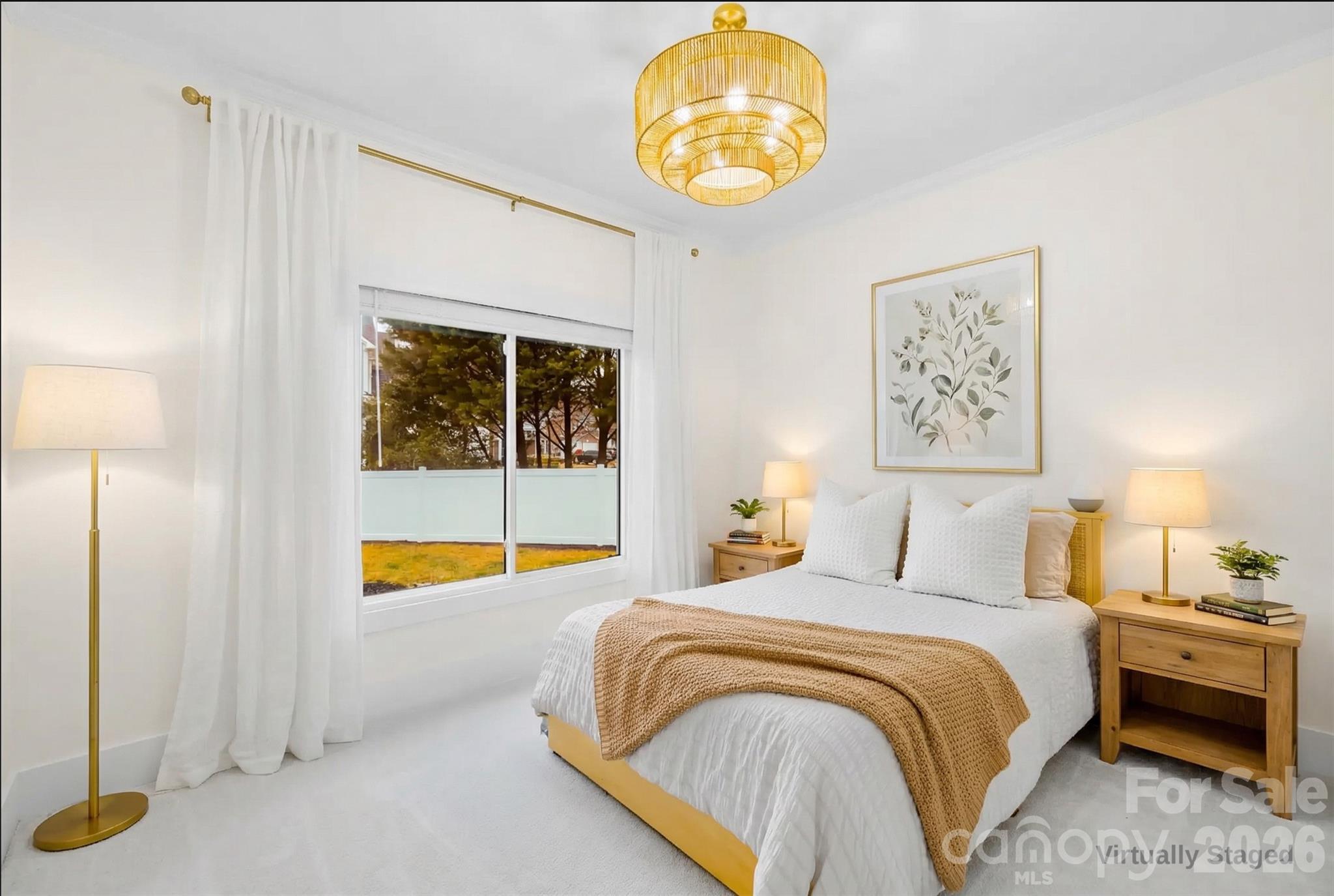 18441 Davidson-Concord Road Davidson, NC 28036 - Photo 16 of 36 a bedroom with a bed and a chandelier