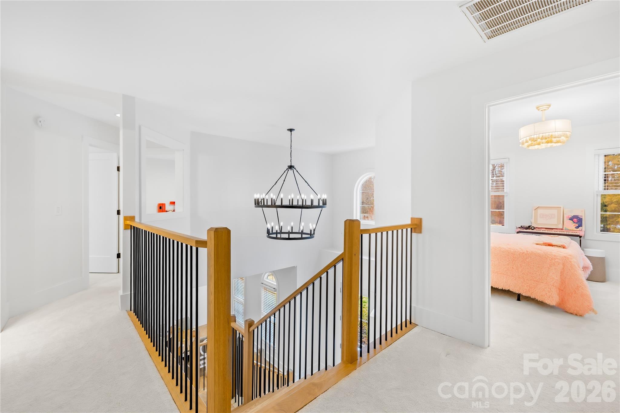 18441 Davidson-Concord Road Davidson, NC 28036 - Photo 18 of 36 a view of hallway with furniture and a chandelier
