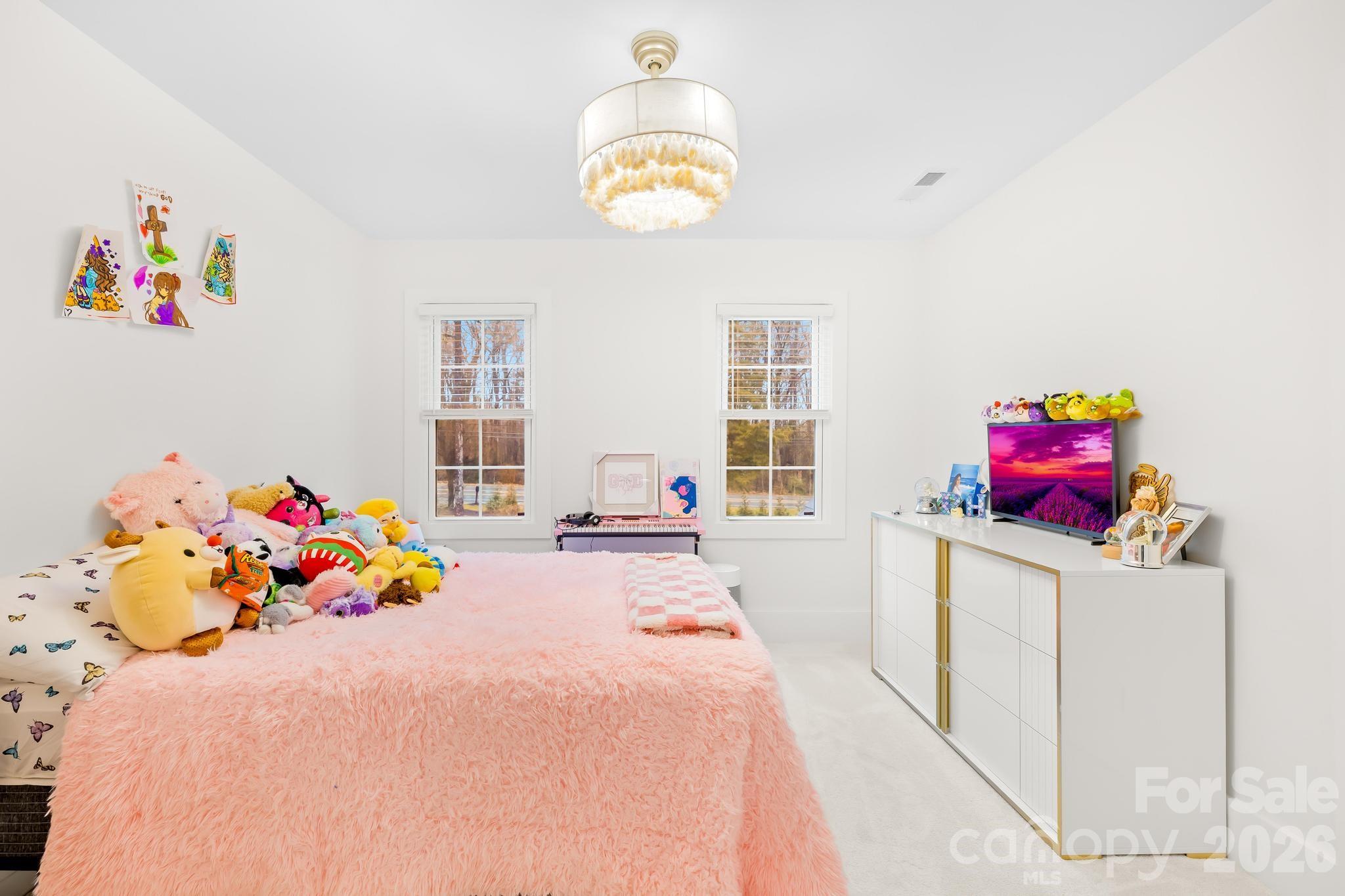 18441 Davidson-Concord Road Davidson, NC 28036 - Photo 19 of 36 a bedroom with a bed a couch and dresser