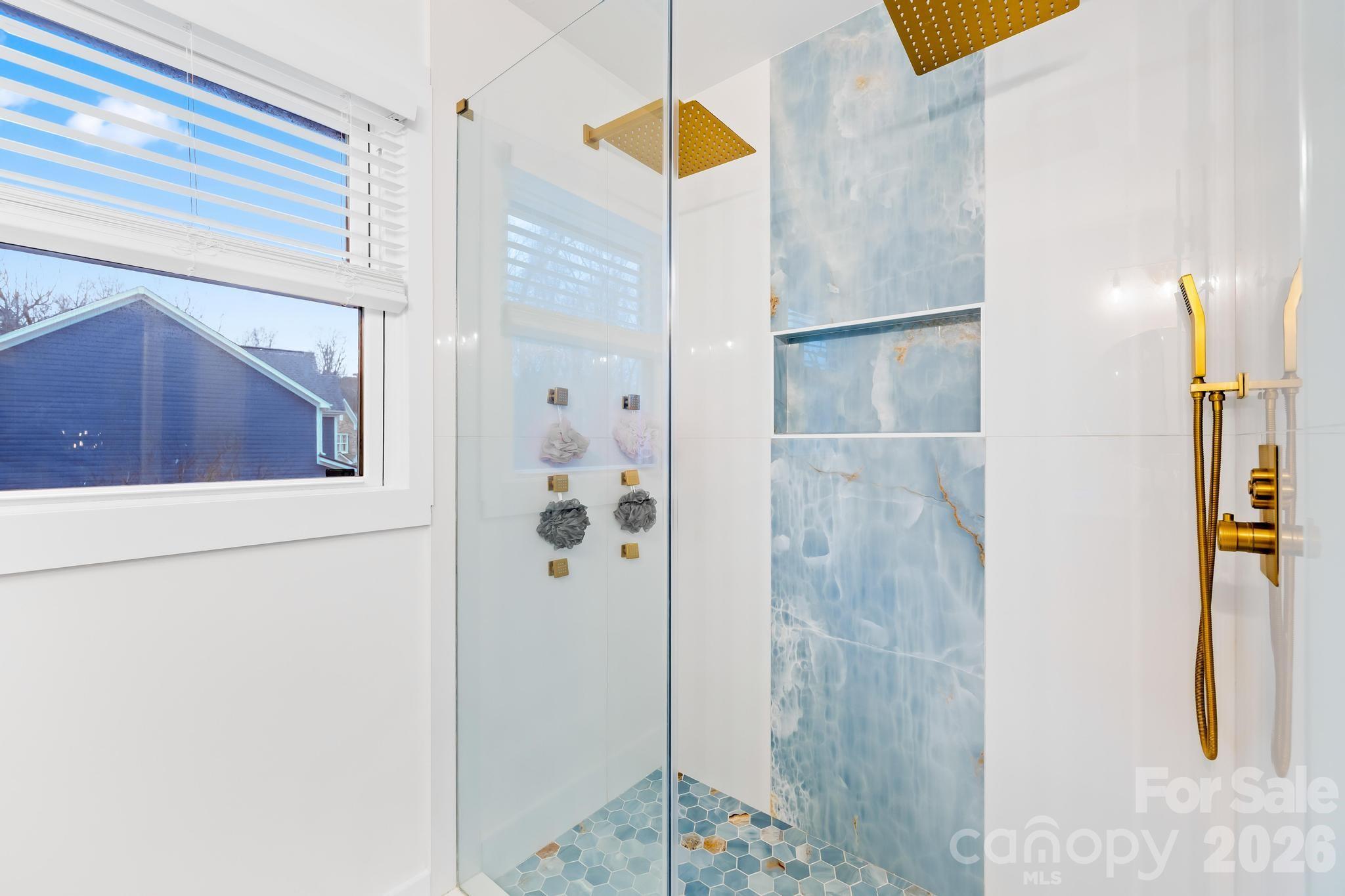 18441 Davidson-Concord Road Davidson, NC 28036 - Photo 21 of 36 a bathroom with a mirror and shower
