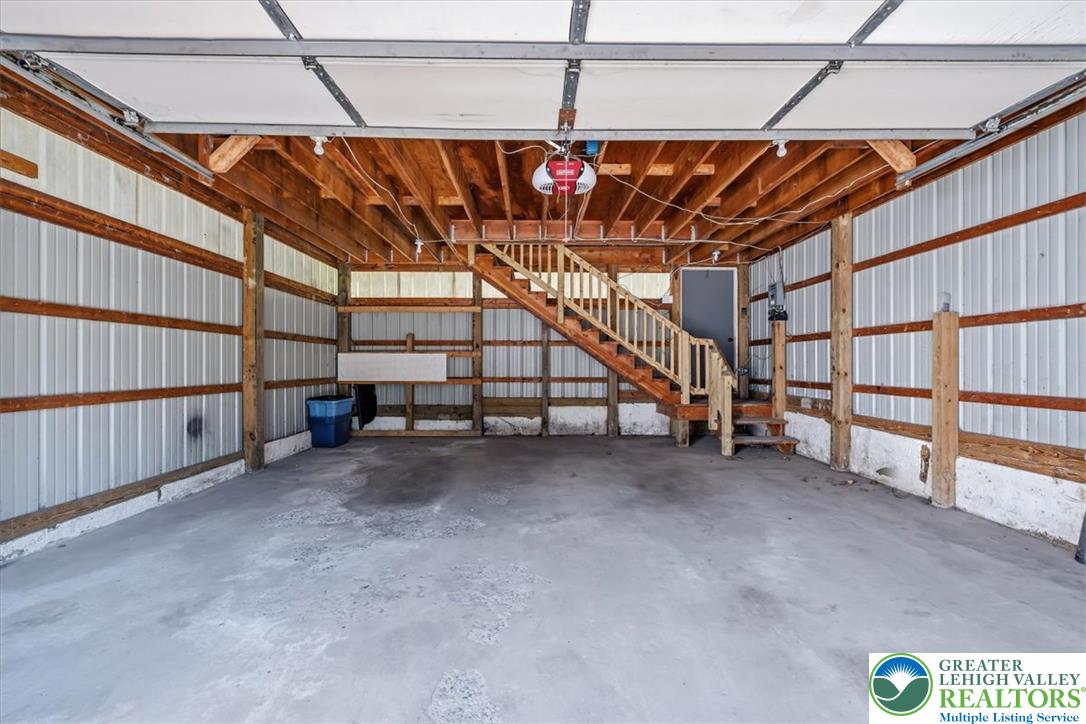 3453 Main Street Slatington, PA 18080 - Photo 22 of 30 Ample garage space with robust wooden framing and a convenient interior stairway.