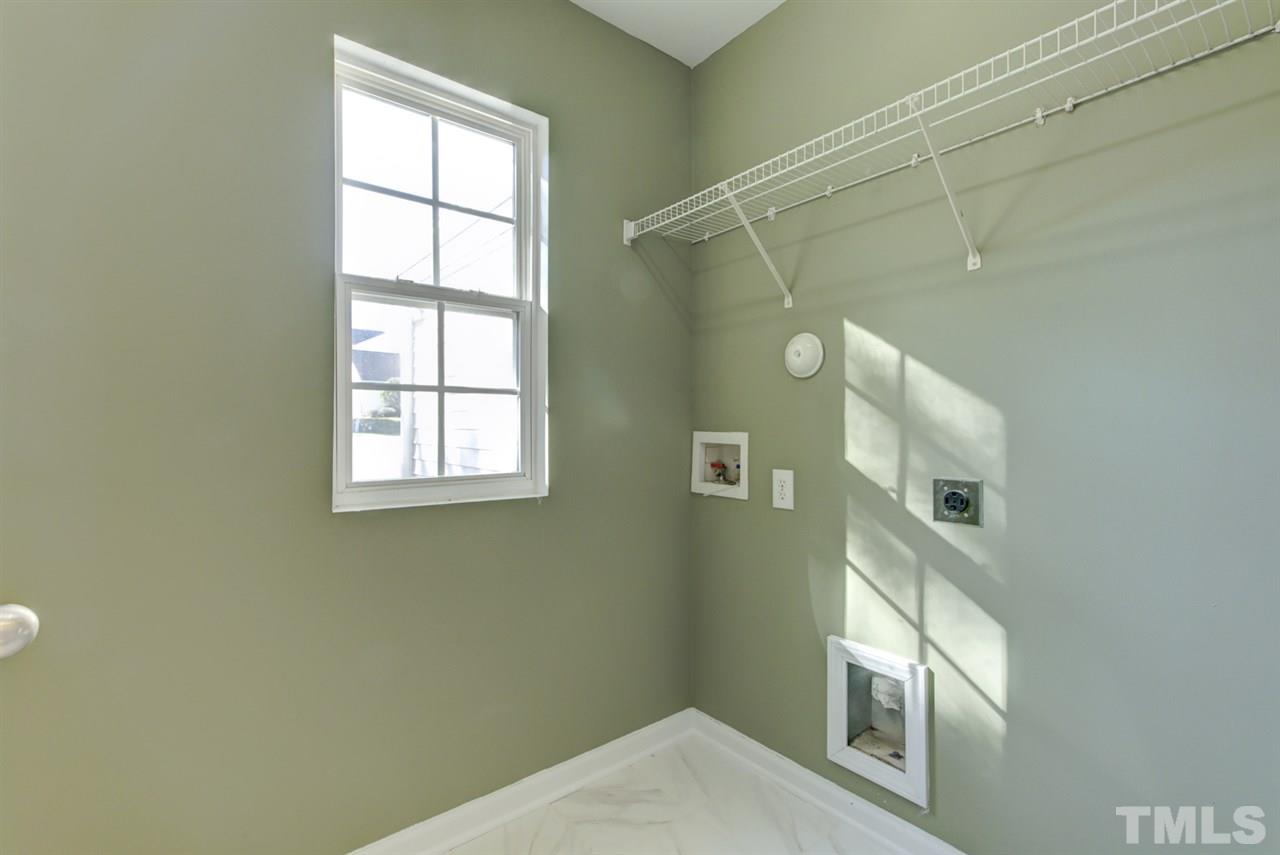 5056 Babbling Brook Drive Raleigh, NC 27610 - Photo 11 of 28 tile floor with lots of lights on the first floor