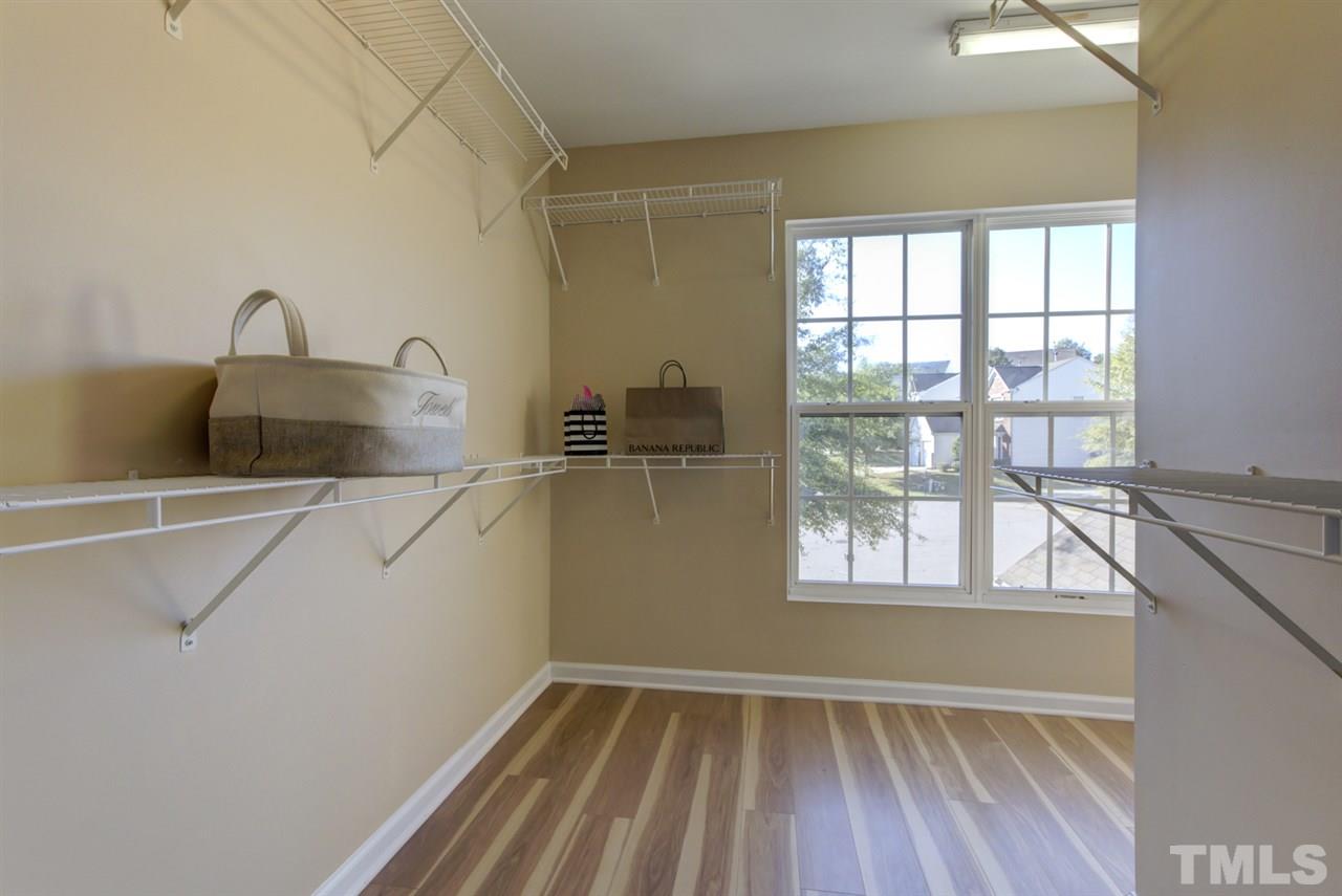 5056 Babbling Brook Drive Raleigh, NC 27610 - Photo 16 of 28 huge master closet with lots of shelves. full of natural lights.