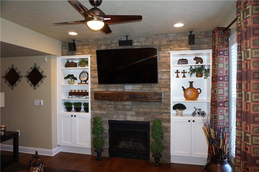1011 Timber Ridge Court Harrison City, PA 15636 - Photo 14 of 25 Another focal point of this amazing space is the Gas fireplace set into the stone wall with custom built book cases! The fireplace is not needed for heat however as this space comes equipped with its very own heating and cooling system.