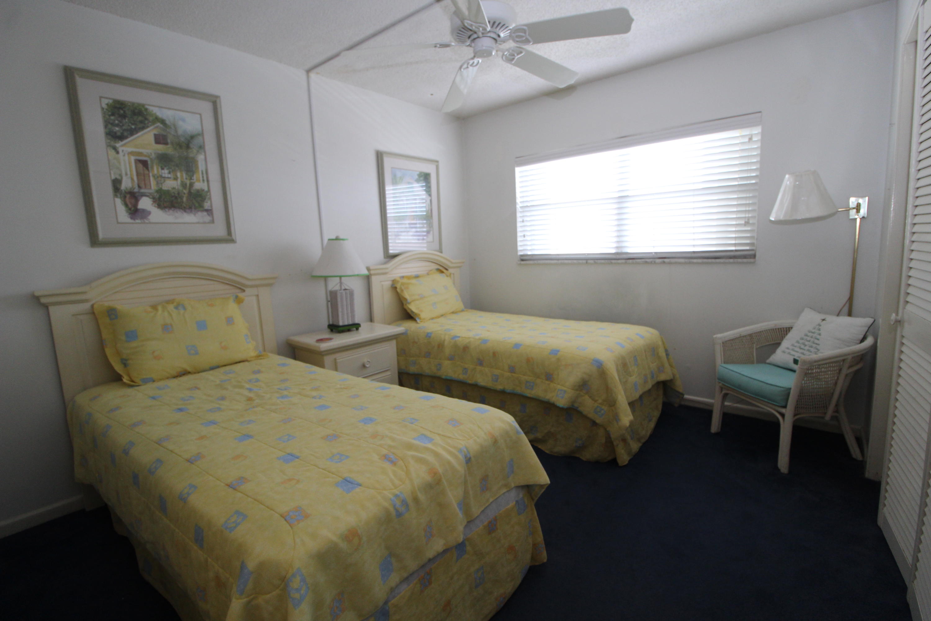 909 Santa Rosa Boulevard, Unit 548 Fort Walton Beach, FL 32548 - Photo 12 of 22 a bedroom with two beds and a window