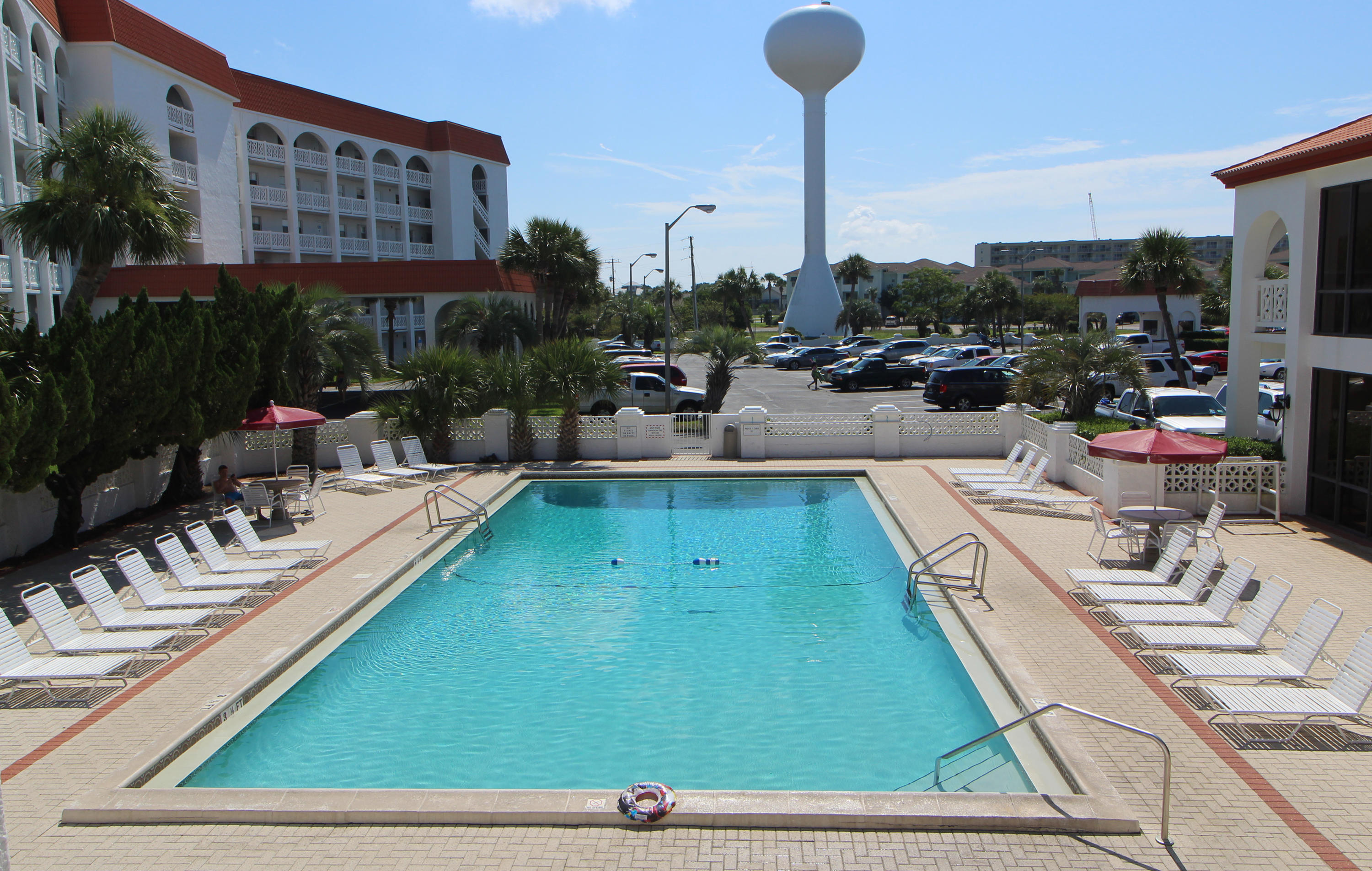 909 Santa Rosa Boulevard, Unit 548 Fort Walton Beach, FL 32548 - Photo 16 of 22 a view of a swimming pool with outdoor seating