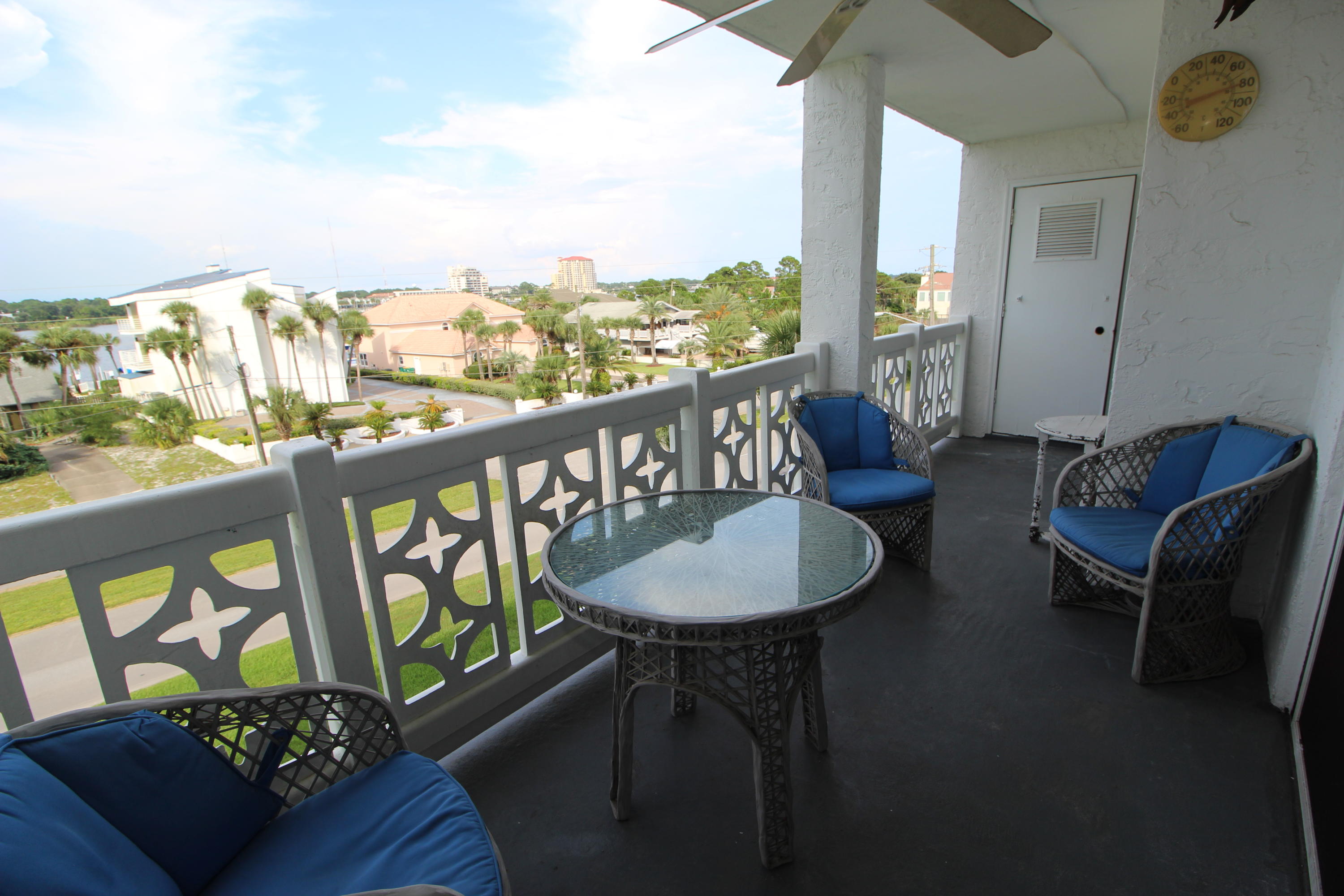 909 Santa Rosa Boulevard, Unit 548 Fort Walton Beach, FL 32548 - Photo 2 of 22 a living room with furniture and a floor to ceiling window