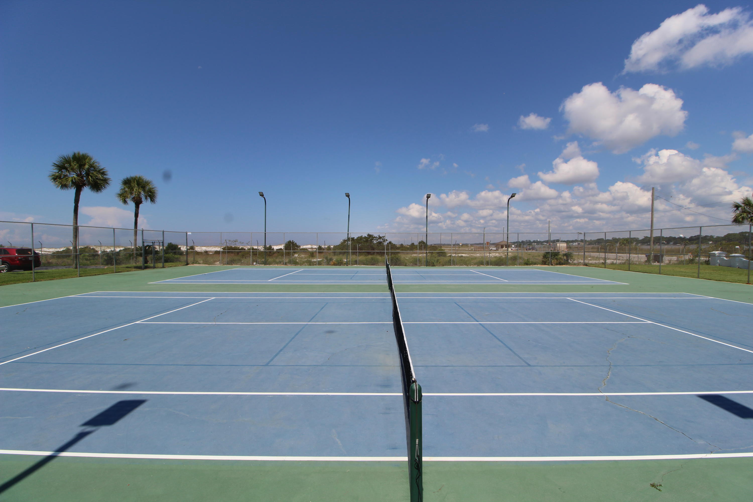 909 Santa Rosa Boulevard, Unit 548 Fort Walton Beach, FL 32548 - Photo 21 of 22 a view of a tennis court