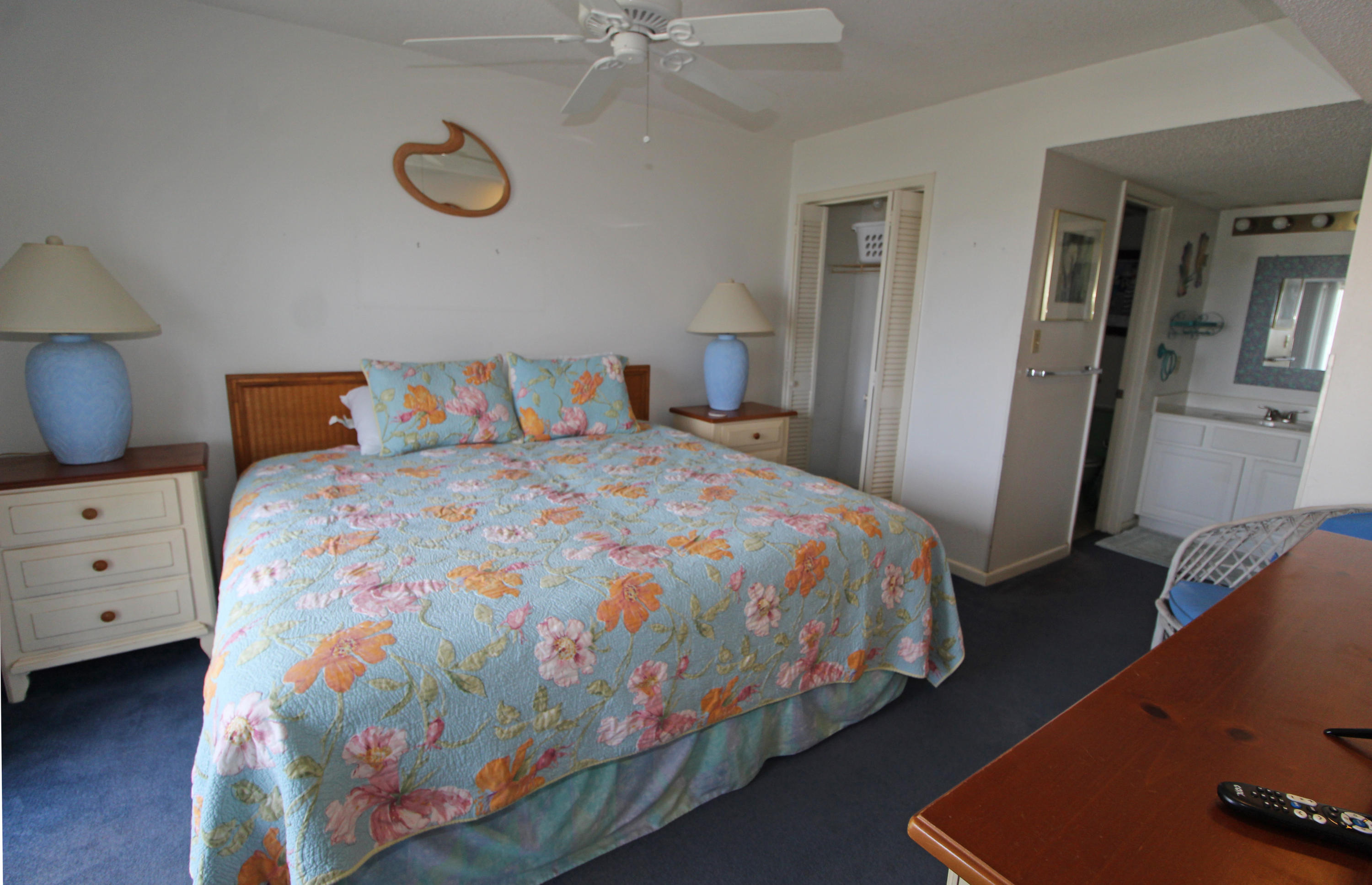909 Santa Rosa Boulevard, Unit 548 Fort Walton Beach, FL 32548 - Photo 9 of 22 a bedroom with a bed and a lamp on the dresser