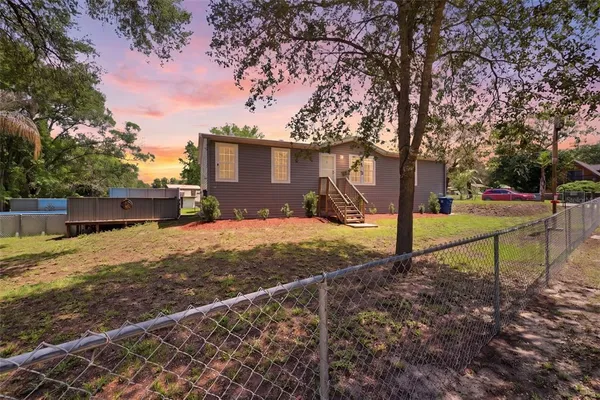 a house view with a backyard space