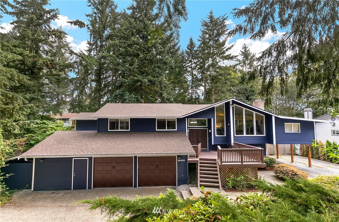 24303 23rd Avenue West Bothell, WA 98021 - Photo 1 of 25 a front view of a house with a yard and garage