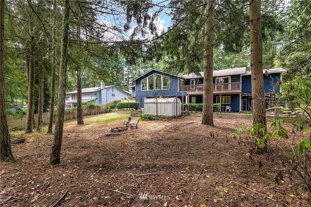 24303 23rd Avenue West Bothell, WA 98021 - Photo 23 of 25 a backyard of a house with barbeque oven table and chairs