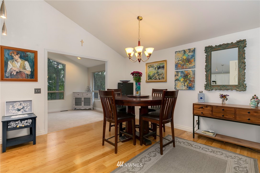 24303 23rd Avenue West Bothell, WA 98021 - Photo 5 of 25 a view of a dining room with furniture and chandelier
