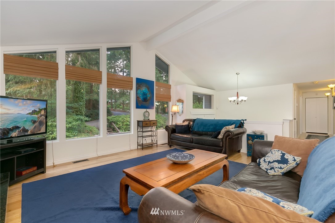 24303 23rd Avenue West Bothell, WA 98021 - Photo 6 of 25 a living room with furniture and a floor to ceiling window