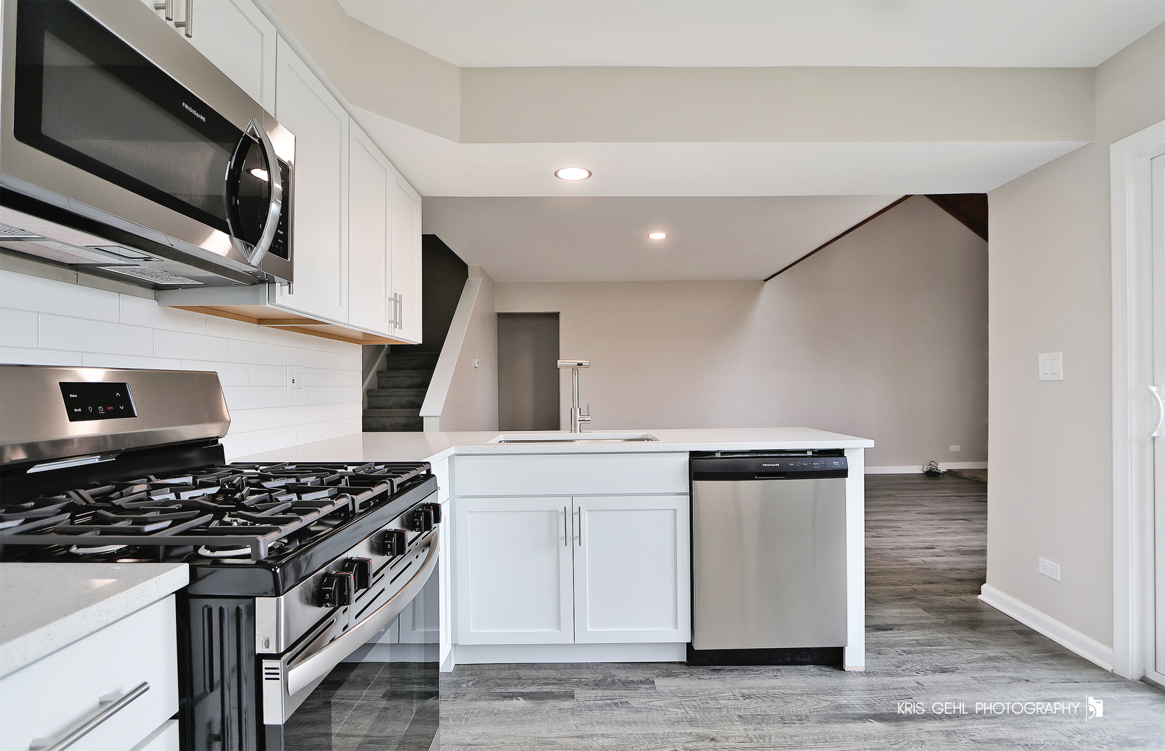 695 Wakefield Road Gurnee, IL 60031 - Photo 9 of 24 a kitchen with stainless steel appliances granite countertop a stove and a microwave