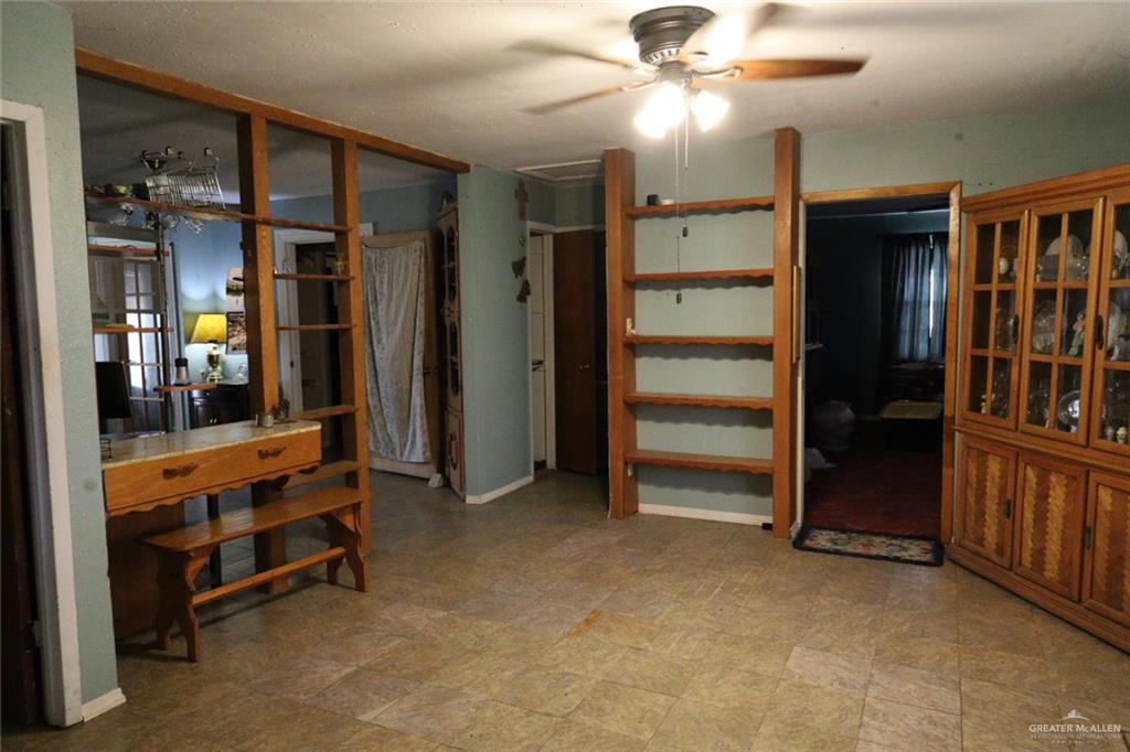 7716 North Val Verde Road Donna, TX 78537 - Photo 11 of 17 a view of an empty room with window and a ceiling fan