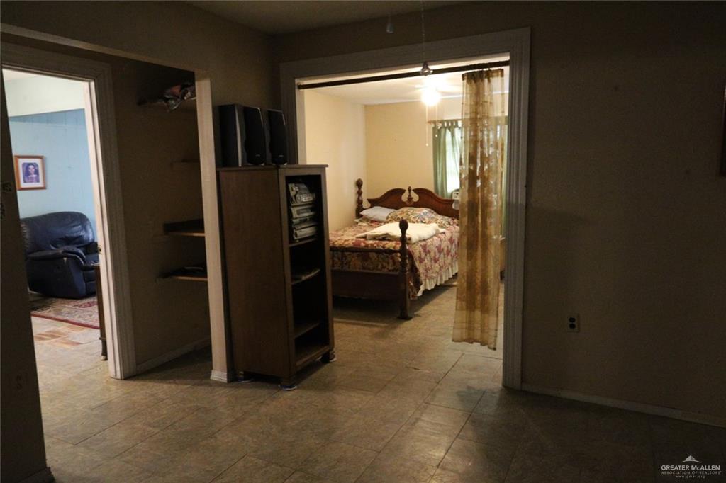 7716 North Val Verde Road Donna, TX 78537 - Photo 14 of 17 a view of a room that has a bed