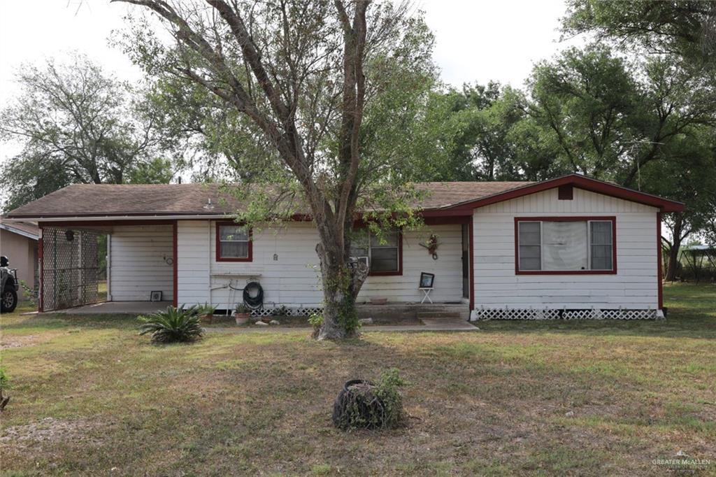 7716 North Val Verde Road Donna, TX 78537 - Photo 2 of 17 a view of a house with a yard and large tree