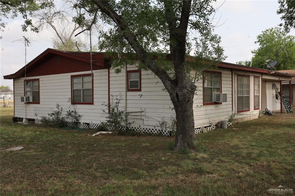 7716 North Val Verde Road Donna, TX 78537 - Photo 7 of 17 a front view of a house with garden