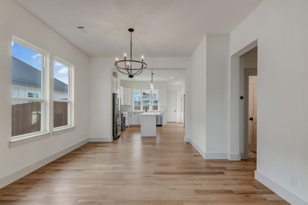 205 West 7th Street Justin, TX 76247 - Photo 15 of 35 a view of empty room with wooden floor