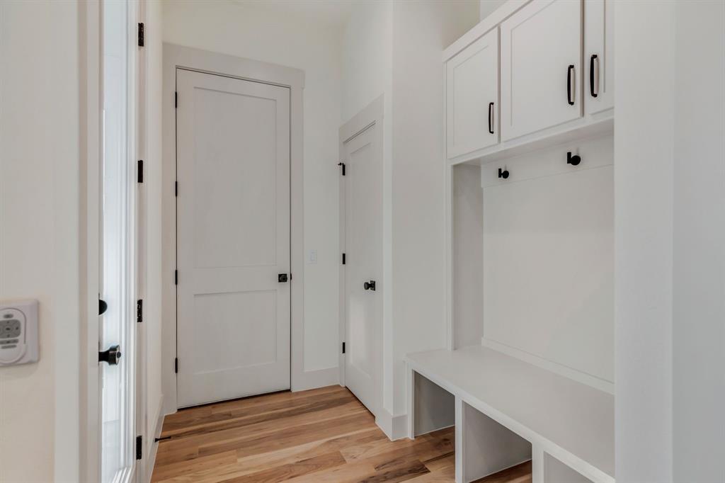 205 West 7th Street Justin, TX 76247 - Photo 20 of 35 a view of an entryway with wooden floor