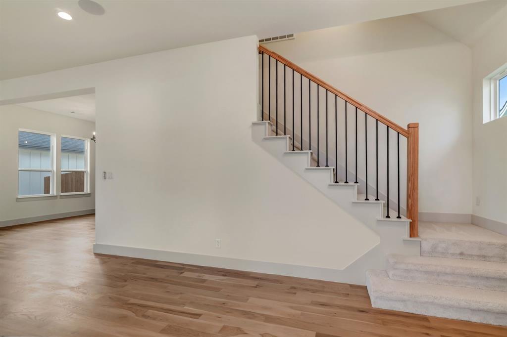205 West 7th Street Justin, TX 76247 - Photo 8 of 35 a view of a hallway with wooden floor and entryway